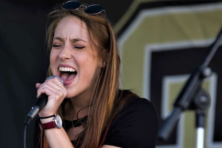 CU Denver CAM student singing at block party