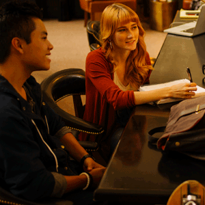 A group of cu denver students sitting at a table and talking