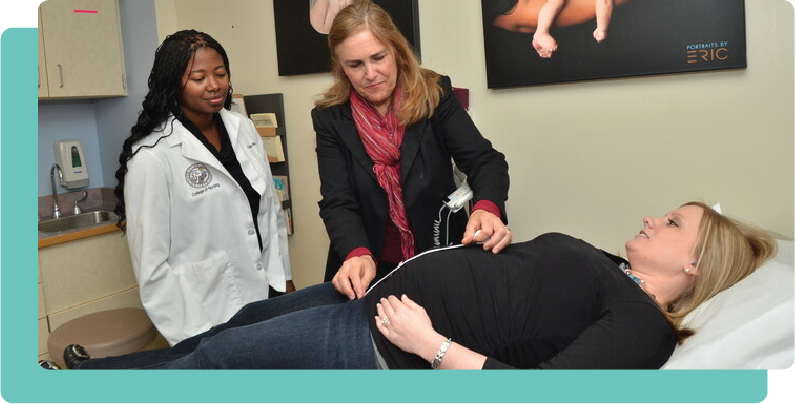 Female nurse expert with female nurse student and pregnant patient