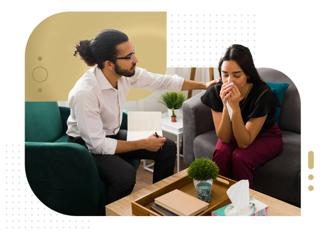 Male nurse speaking with a female patient