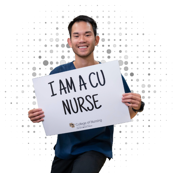 Student holding sign