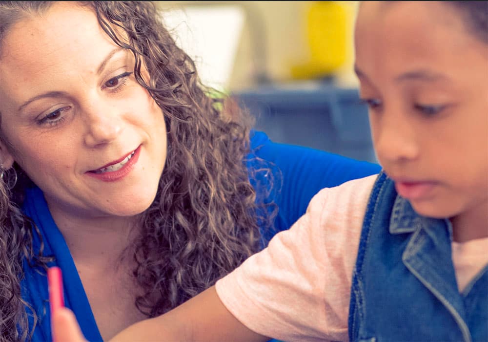 A teacher and young student