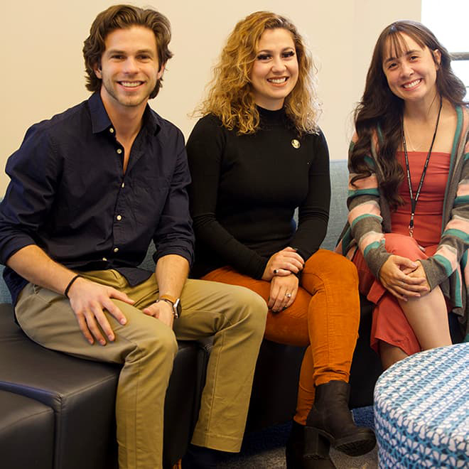 Alumna Marta Spirk with two students from Brazil.