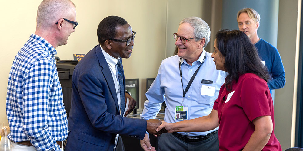 CU Denver Provost greeting faculty