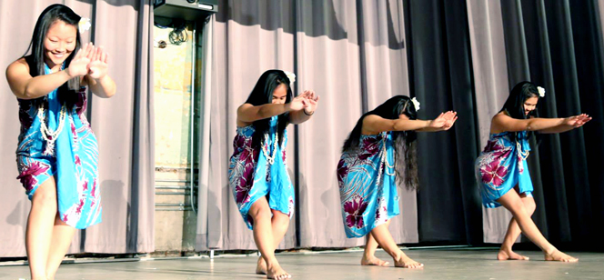 students performing on stage