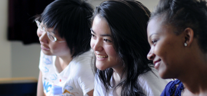 students listening and smiling