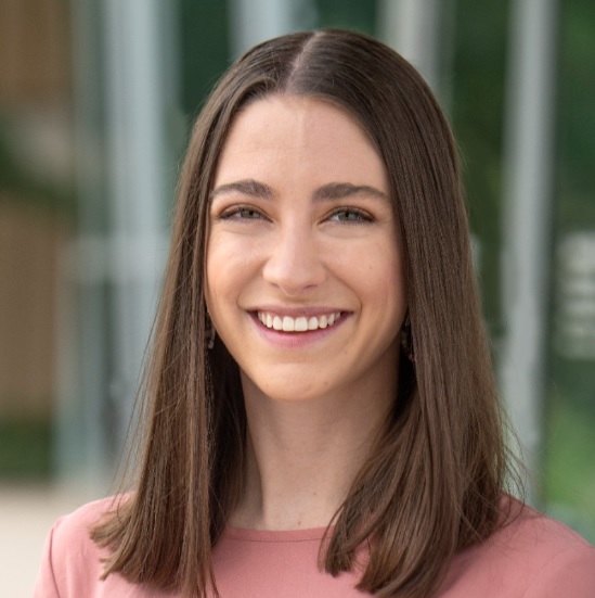 Close-up headshot of Ashley Barker smiling.