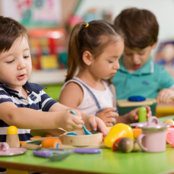 Preschool children eating at a table